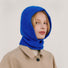 Model wearing a vibrant blue knitted balaclava for full head and neck warmth.