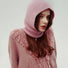 Model wearing the soft pink knitted balaclava, providing a gentle and warm winter aesthetic.