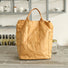 Front view of a tan Kraft-like edgy tote bag with a unique crinkled paper texture, showcasing a minimalist industrial design.