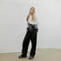 Model carrying a Large Quilted Slouchy Bag as crossbody in black, easy for commuting and weekends.
