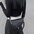 Model carrying a black Leather Threaded Saddle Bag as crossbody, great for daily carry and travel.