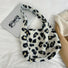 Flat lay of Leopard Print Tweed Tote bag in beige, great for everyday carry and travel.