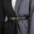 Model wearing the black linked loop belt for minimalist daily outfit.