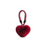 Fluffy red heart bag charm with a red polyester loop and black accents.