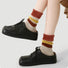 Model wearing a pair of Maillard Plush Splicing Socks, great for casual wear and light workouts.