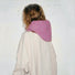 Back view of a mauve pink knitted balaclava hat, showing the seamless hood design and drape.