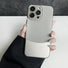 Model holding Metal Leather Splicing Case. Contemporary mix of metallic accents and soft faux leather.