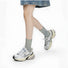 Model wearing a pair of Metallic Tie Dye Slouch Socks in gray, great for daily wear and lounging.