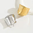 Angled view of two Metallic Wave Hair Cuff in gold and silver , ideal for quick updos and ponytails.