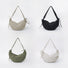 Group display of the mini duvet crescent bag in khaki, black, olive green, and white colors.