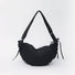 Classic black mini duvet crescent bag highlighting its sleek padded silhouette.