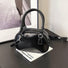 Folded view of Mini Leather Bowling Bag in black, easy for commuting and weekends.