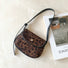 Front view of Mini Leopard Suede Saddle Bag, ideal for errands and gifting.