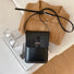Folded view of Minimalist Rigid Leather Bag, in black, easy for commuting and weekends.