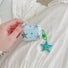 Model Hands holding a Oceanic Star Charm Airpods Case Cover,easy to carry for commutes and travel.