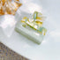 Angled view of green Oil Painting hair claw in cube shape, ideal for quick updos and ponytails.