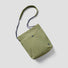 Front view of the Breezy Trail Bag in olive green, featuring a clean silhouette and snap closure.