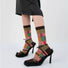 Model wearing a pair of Plaid Patchwork Socks in brown, ideal for workouts and commuting.