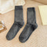 Flat lay of Plush Cozy Socks in gray, great for daily wear and lounging.