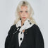 Model styling black and white polka dot knit triangle scarf around neck.