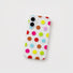 Clear silicone phone case patterned with colorful pastel polka dots resting flat.