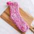 Close-up of Pompom Cupcake Socks in magenta socks, great for daily wear and lounging.