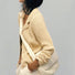 Model carrying a white polyester bag on the shoulder, easy for commuting and weekends.