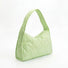 Side view of the lime green argyle quilted hobo bag with a cloud-like texture.