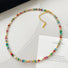 Rainbow beaded necklace featuring a colorful bead arrangement.