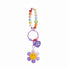 Flat lay of Rainbow Beads Sunflower Bag Charm in purple, great for everyday styling and gifting.