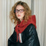 Side view of a red drawstring balaclava hat, emphasizing the cozy hood and neck coverage.
