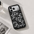 Close-up angle of the rose lace clear phone case resting on a white surface showing camera bumper cutouts.