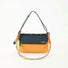 Front view of Yellow and green Rope Play bag styled as a shoulder purse.