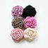 Group shot showing various fabric rose hair claw clips including dusty pink, greige, red, mauve, black and beige.