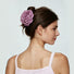 Side view of a model featuring a mauve rose hair claw clip .