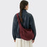 Model carrying a burgundy Ruched Strap Suede Hobo Bag on shoulder, great for daily carry and travel.