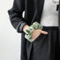 Front view of Green Satin Wristband Case. Emerald satin-texture wristlet integrated on a protective base.