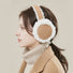 Model wearing Sherpa Earmuffs, easy for gifting and photo-ready styling.