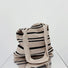 Folded view of oat and black Simple Striped Knitted Bag, easy for commuting and weekends.