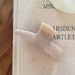 Close-up of Sleek Curved Hair Claw in beige, ideal for quick updos and ponytails.