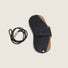 Close-up of Sleek Lychee Glasses Case with the detached strap placed to beside.