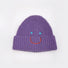 Front view of Smiley Ribbed Knit Beanie in purple. Bold winter accessory with fun handcrafted embroidery.