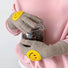 Khaki smiling round face gloves with plush knit and smile patch, flat lay; warm and playful for cold days.