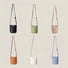 Display showing the crossbody bag in 6 colors, including black, green, khaki, white, blue and brown.