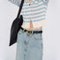 Model styling the black Spiral Triangle Belt, stylish design for daily wear