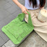 Model carrying a green Square Pattern Crochet Bag in hand, ideal for city walks and gifting.