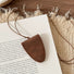 Close-up of Suede Arrow Eyeglass Holder Necklace in Brown, easy to style.