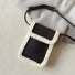 Flat lay of Suede Crossbody Bag With Plush Trim in black, great for everyday carry and travel.