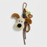 Close-up of the Super Dog bag charm with carabiner, ropes and heart tag.