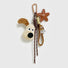 Close-up of the Super Dog plush bag charm with carabiner, ropes and star.
